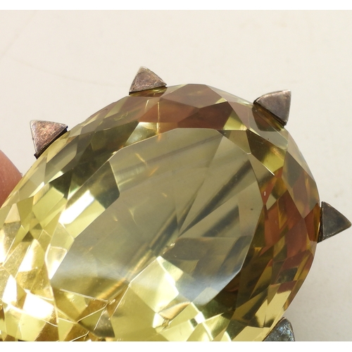 743 - A Victorian citrine brooch with a white metal star mount, and set with a 35mm 27mm x 21mm specimen c...