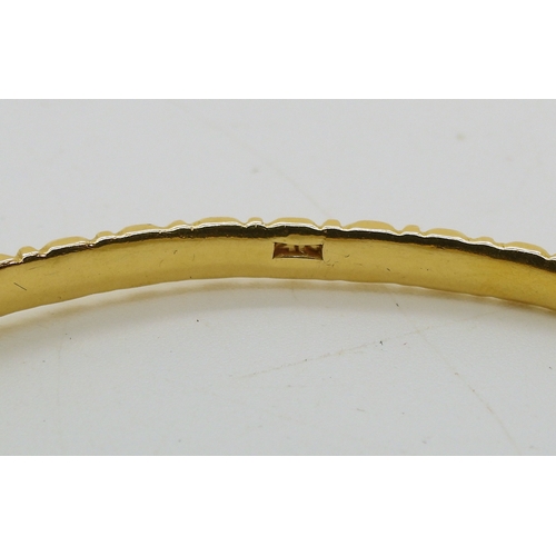 700 - A bright yellow metal bangle stamped 21C, diameter6.3cm, weight 13.8gms...