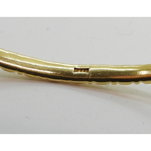 700 - A bright yellow metal bangle stamped 21C, diameter6.3cm, weight 13.8gms...