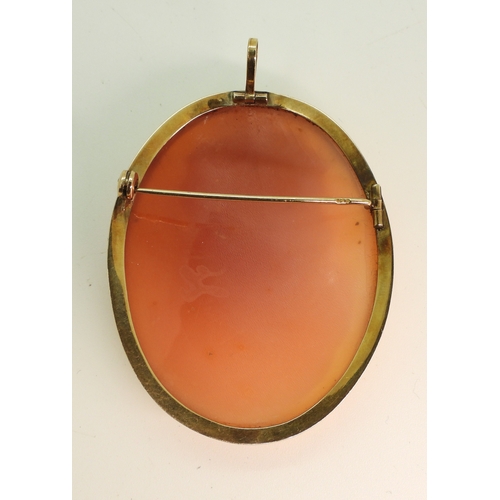 704 - A large shell cameo carved with a maiden, and mounted in a 14k brooch mount, dimensions 5cm x 4cm, w...