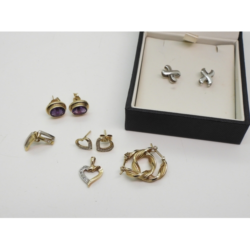 705 - A pair of 18ct white gold cross earrings weight 1.3gms, together with a pair of 9ct gold heart shape...