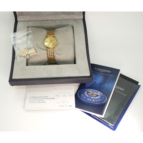 707 - A gold plated Longines La Grande Classique, with spare links, paperwork and original box....