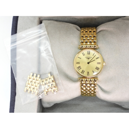 707 - A gold plated Longines La Grande Classique, with spare links, paperwork and original box....