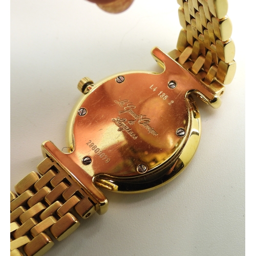 707 - A gold plated Longines La Grande Classique, with spare links, paperwork and original box....