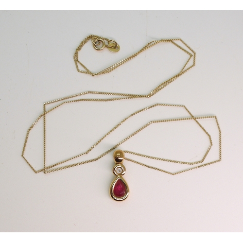 712 - A 9ct ruby and diamond pendant on a 52cm chain, weight 1.9gms...