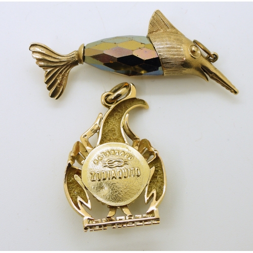 713 - A 9ct gold large swordfish pendant, length 5cm, weight 6.6gms, together with a yellow metal Scorpio ...