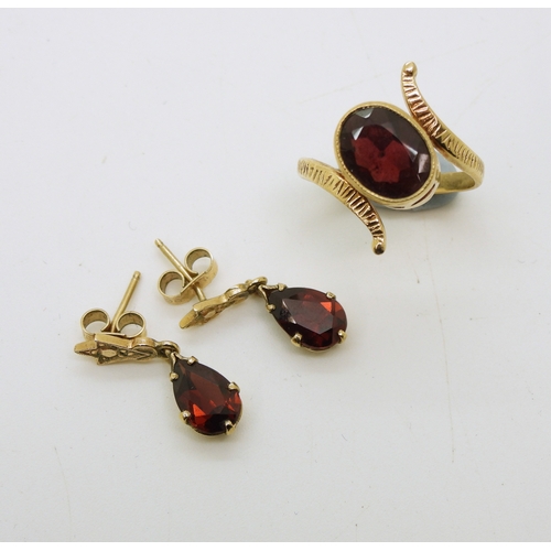 714 - A yellow metal garnet ring, size O, together with a pair of garnet drop earrings, length 2cm, weight...
