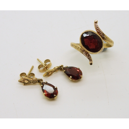 714 - A yellow metal garnet ring, size O, together with a pair of garnet drop earrings, length 2cm, weight...