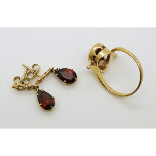 714 - A yellow metal garnet ring, size O, together with a pair of garnet drop earrings, length 2cm, weight...