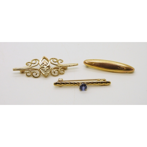 719 - Three 9ct brooches, one set with a sapphire of approx 4.4mm, weight all together 5.9gms...