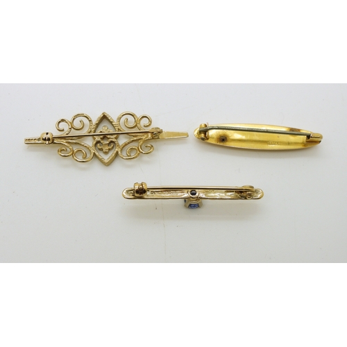 719 - Three 9ct brooches, one set with a sapphire of approx 4.4mm, weight all together 5.9gms...