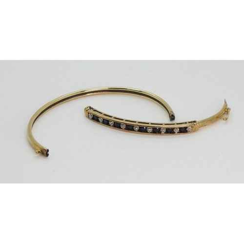 723 - A 9ct gold sapphire and diamond accent bangle (af) weight 5.2gms...