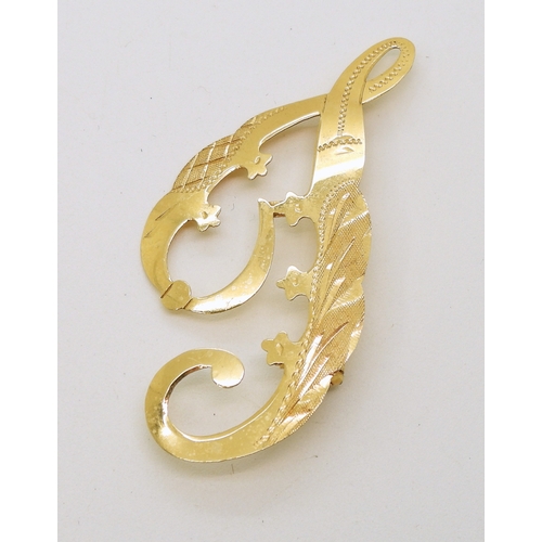 729 - An 18ct gold 'J' brooch, weight 2.3gms...