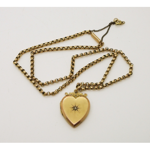 731 - A 9ct gold back & front heart shaped locket set with a rose cut diamond, on a 9ct gold vintage b...