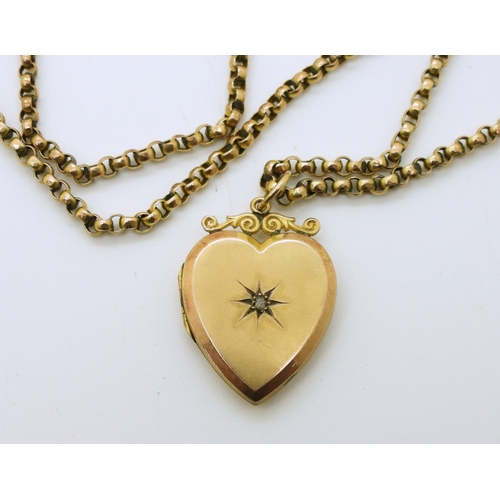 731 - A 9ct gold back & front heart shaped locket set with a rose cut diamond, on a 9ct gold vintage b...