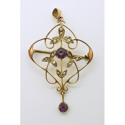 737 - A yellow metal Edwardian pendant set with purple glass and pearls, length 5.5cm, weight 2.9gms...