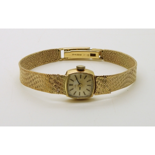 740 - A 9ct gold ladies Tissot watch with integral woven strap, length 18.5cm, weight including mechanism ...