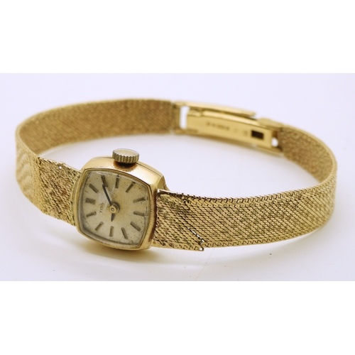 740 - A 9ct gold ladies Tissot watch with integral woven strap, length 18.5cm, weight including mechanism ...