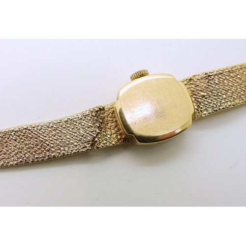 740 - A 9ct gold ladies Tissot watch with integral woven strap, length 18.5cm, weight including mechanism ...