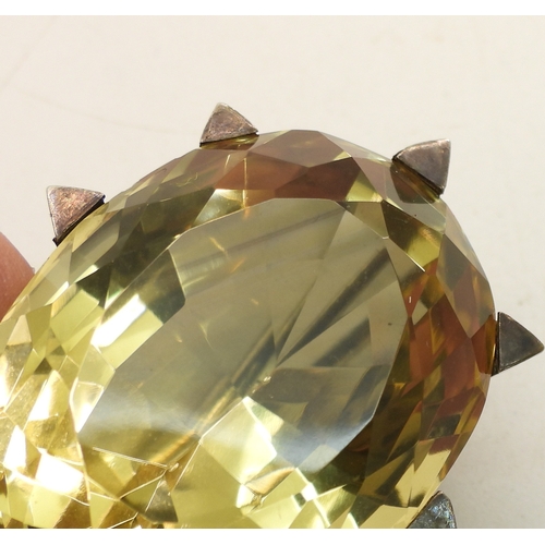 743 - A Victorian citrine brooch with a white metal star mount, and set with a 35mm 27mm x 21mm specimen c...