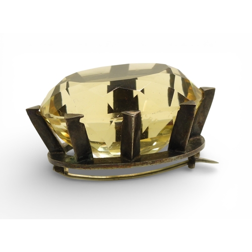 743 - A Victorian citrine brooch with a white metal star mount, and set with a 35mm 27mm x 21mm specimen c...