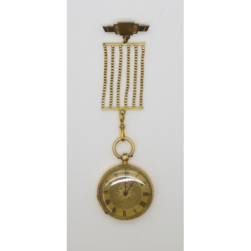 745 - An 18k gold fob watch, diameter 3.5cm, weight of watch with mechanism 34.4gms with a gold plated sil...