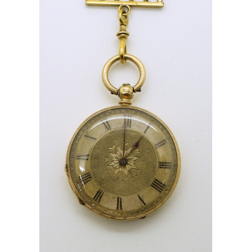 745 - An 18k gold fob watch, diameter 3.5cm, weight of watch with mechanism 34.4gms with a gold plated sil...
