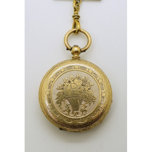 745 - An 18k gold fob watch, diameter 3.5cm, weight of watch with mechanism 34.4gms with a gold plated sil...