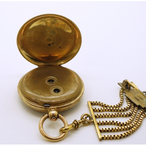 745 - An 18k gold fob watch, diameter 3.5cm, weight of watch with mechanism 34.4gms with a gold plated sil...
