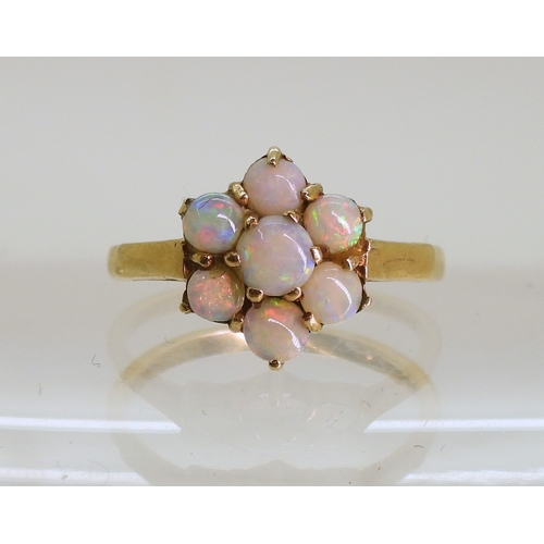 747 - A 9ct gold opal flower ring, size K1/2, weight 2gms...