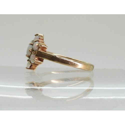 747 - A 9ct gold opal flower ring, size K1/2, weight 2gms...