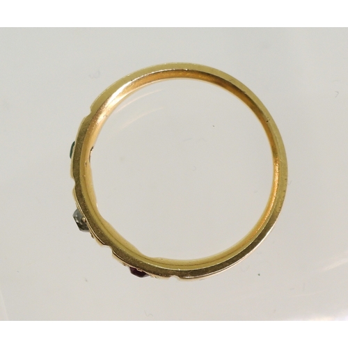 748 - A bright yellow metal ring, star set with a ruby, diamond and emerald, size N, weight 3.6gms...