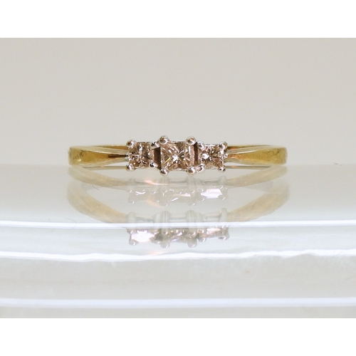749 - A 9ct gold three princess cut diamond ring, finger size P1/2, weight 1.7gms...