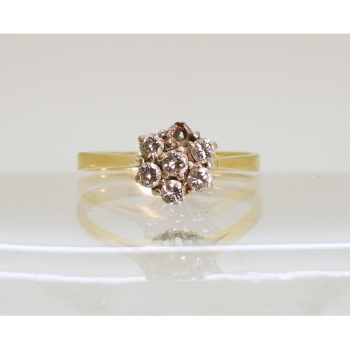 750 - An 18ct gold diamond flower ring, (one diamond missing) size P1/2, weight 2.5gms...