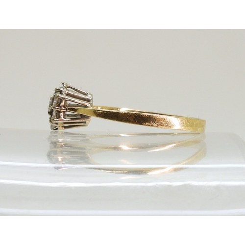 750 - An 18ct gold diamond flower ring, (one diamond missing) size P1/2, weight 2.5gms...