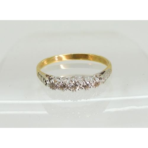753 - A bright yellow metal five stone diamond vintage ring, size Q, weight 2.3gms...