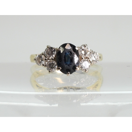 757 - An 18ct gold sapphire and diamond cluster ring, size N, weight 4gms...