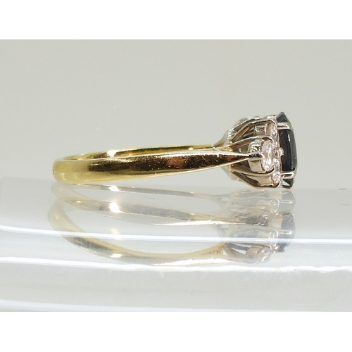 757 - An 18ct gold sapphire and diamond cluster ring, size N, weight 4gms...