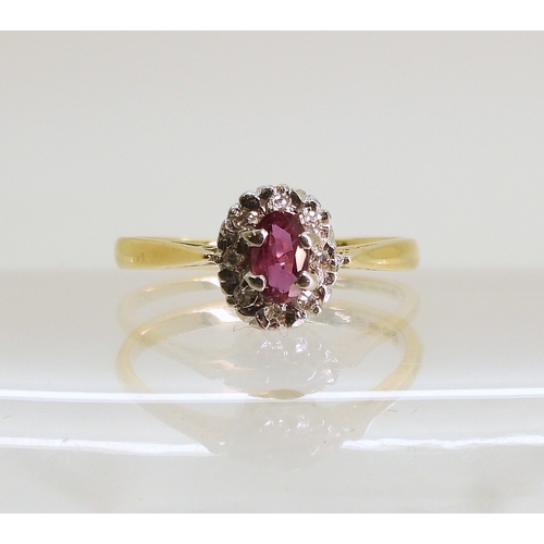 760 - An 18ct gold ruby and diamond accent ring, size L, weight 2.4gms