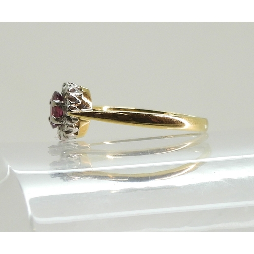 760 - An 18ct gold ruby and diamond accent ring, size L, weight 2.4gms