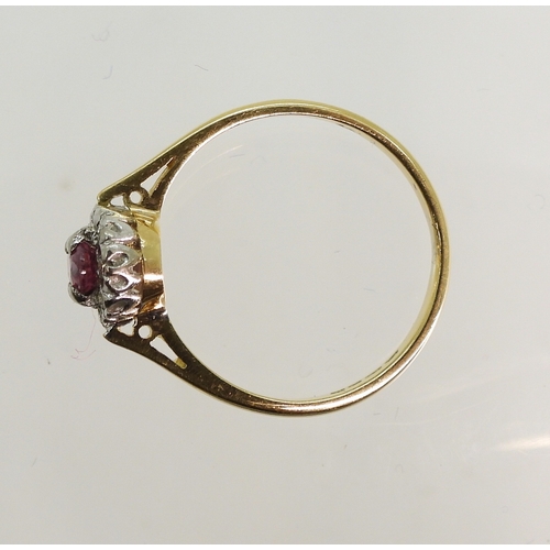 760 - An 18ct gold ruby and diamond accent ring, size L, weight 2.4gms