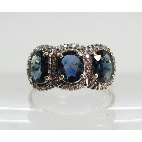 761 - A yellow and white metal ring set with three teal green oval cut sapphires of estimated approx 6.9mm... 