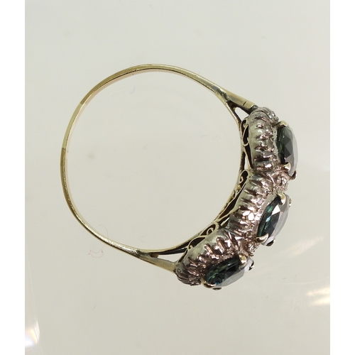 761 - A yellow and white metal ring set with three teal green oval cut sapphires of estimated approx 6.9mm... 