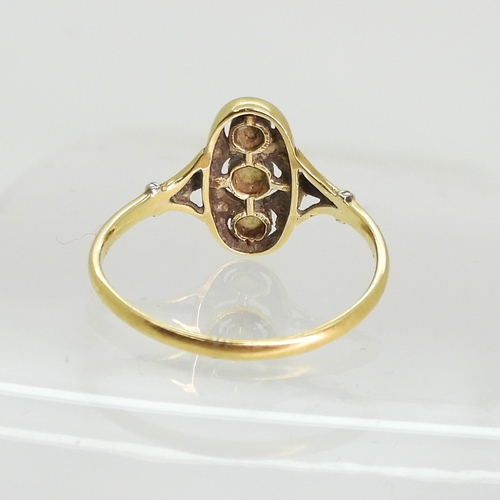 763 - A vintage pearl and diamond accent ring, made in yellow and white metal with fleur de lis shoulders,... 