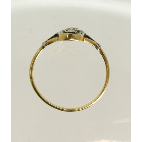 763 - A vintage pearl and diamond accent ring, made in yellow and white metal with fleur de lis shoulders,... 