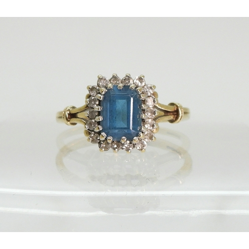 764 - A 9ct gold blue topaz and diamond cluster ring, size Q, weight 3.1gms