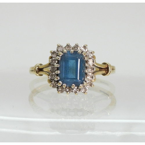 764 - A 9ct gold blue topaz and diamond cluster ring, size Q, weight 3.1gms
