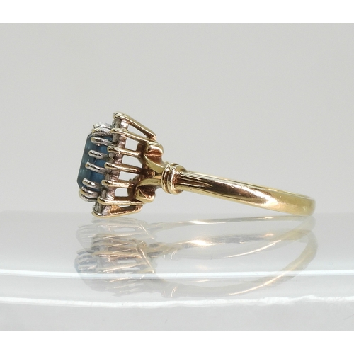 764 - A 9ct gold blue topaz and diamond cluster ring, size Q, weight 3.1gms