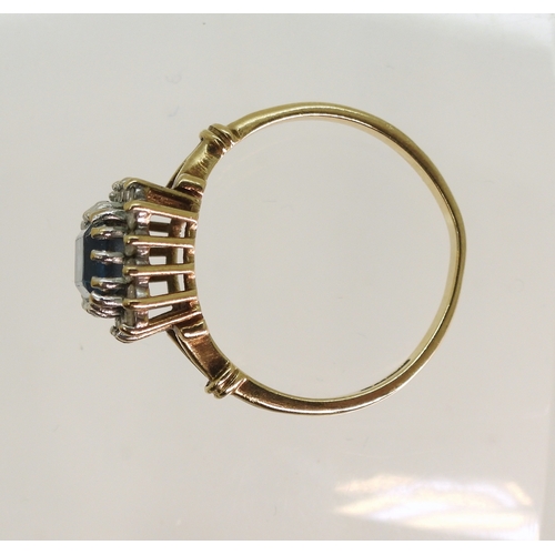 764 - A 9ct gold blue topaz and diamond cluster ring, size Q, weight 3.1gms