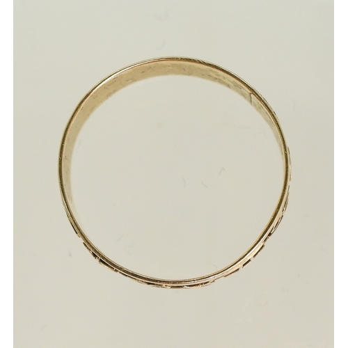 766 - A bright yellow metal Zodiac ring, size k, weight 1.3gms